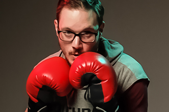 Man in a boxing stance facing the camera