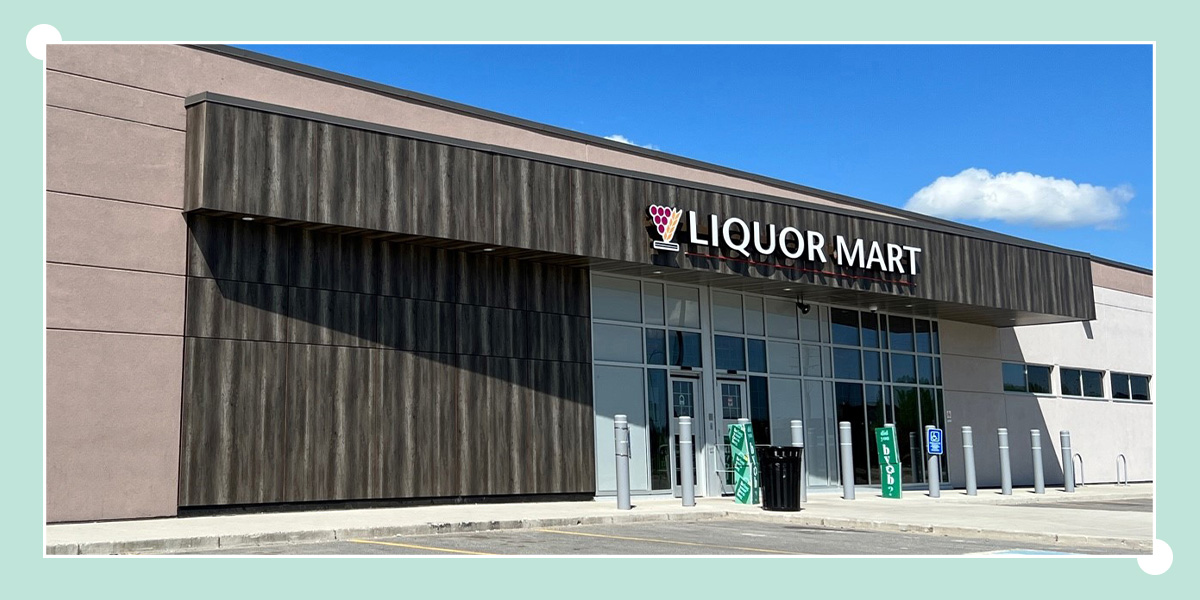 Photo of the external Thompson Liquor Mart building. Inside the photo, a dark blue box in the centre of the photo is the text “Thompson Liquor Mart achieves LEED Canada Gold Certification”.