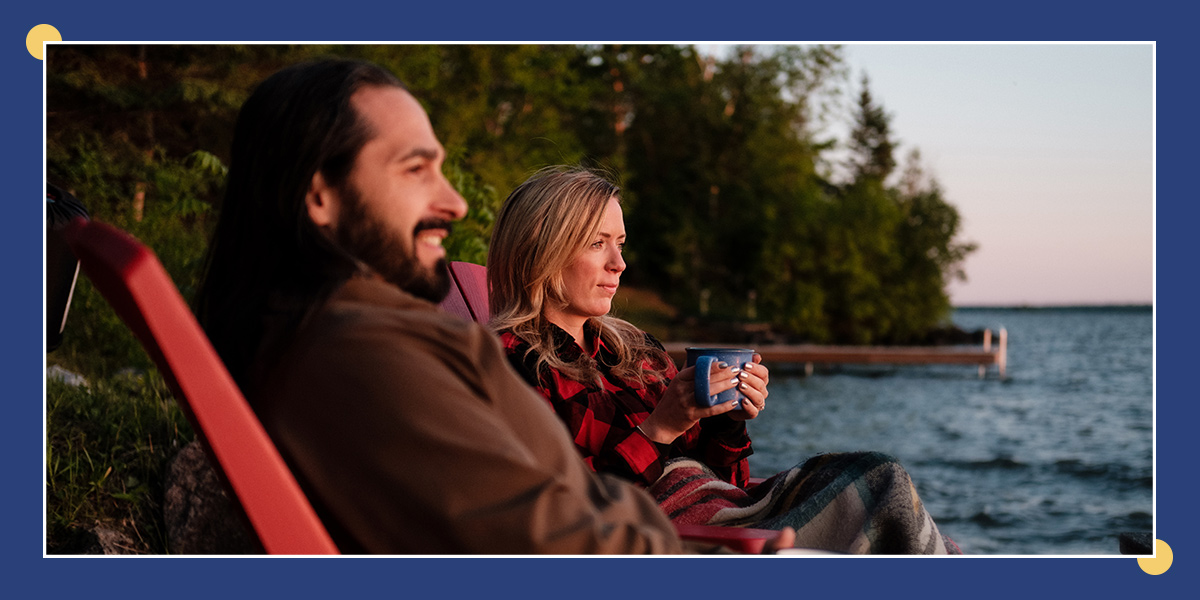 Couple enjoying a coffee lakeside
