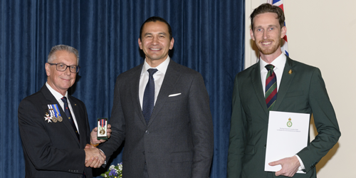 Raymond Levesque receiving the King Charles III Coronation Medal